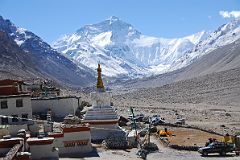 
Everest North Face glistens in the morning sun with Rongbuk Monastery (4976m) in the foreground in October 2010. The mountain in front of Everest is Changtse (7583m, Everest north peak) and the long Everest West Ridge leads to the right with Nuptse (7861m) behind at the far right.
